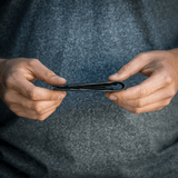 Wayfinder DAYBREAKER modern minimal billfold wallet shown folded in slim view.