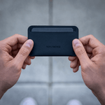 Wayfinder FLUX modern minimal cardholder top view held in hands